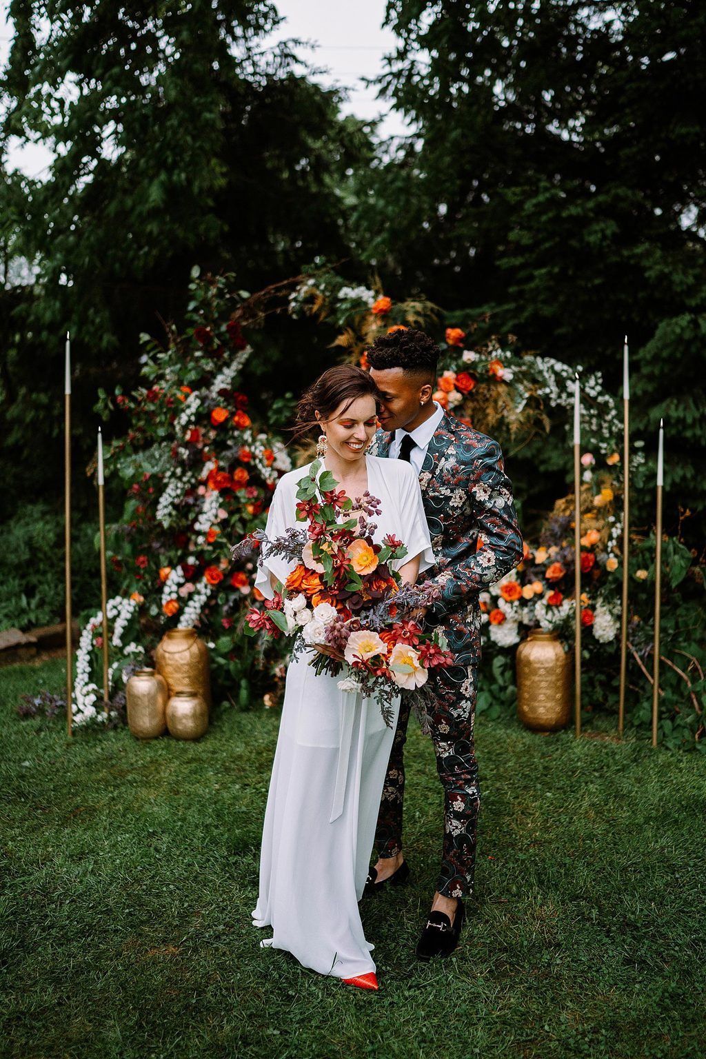boho wedding inspiration with bride in flutter sleeve wedding dress and groom in floral print suit