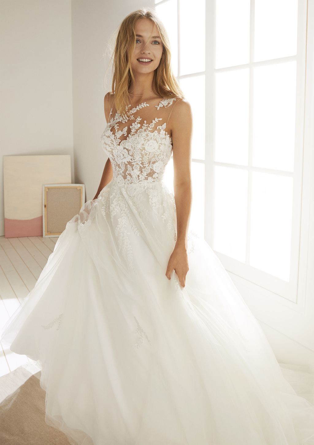 illusion bodice wedding dress with floral appliques and flirty skirt