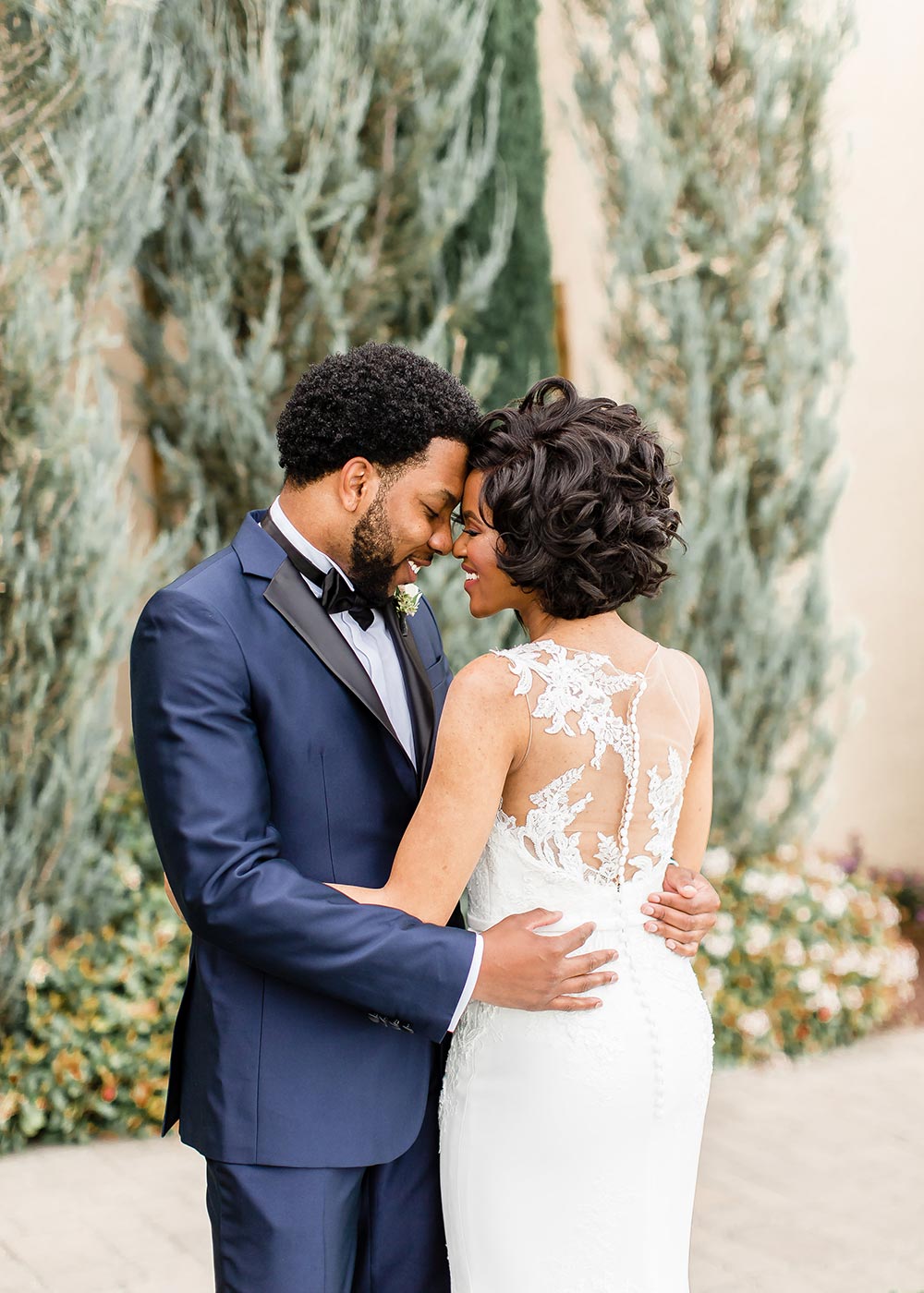 illusion back wedding dress and navy blue groom suit
