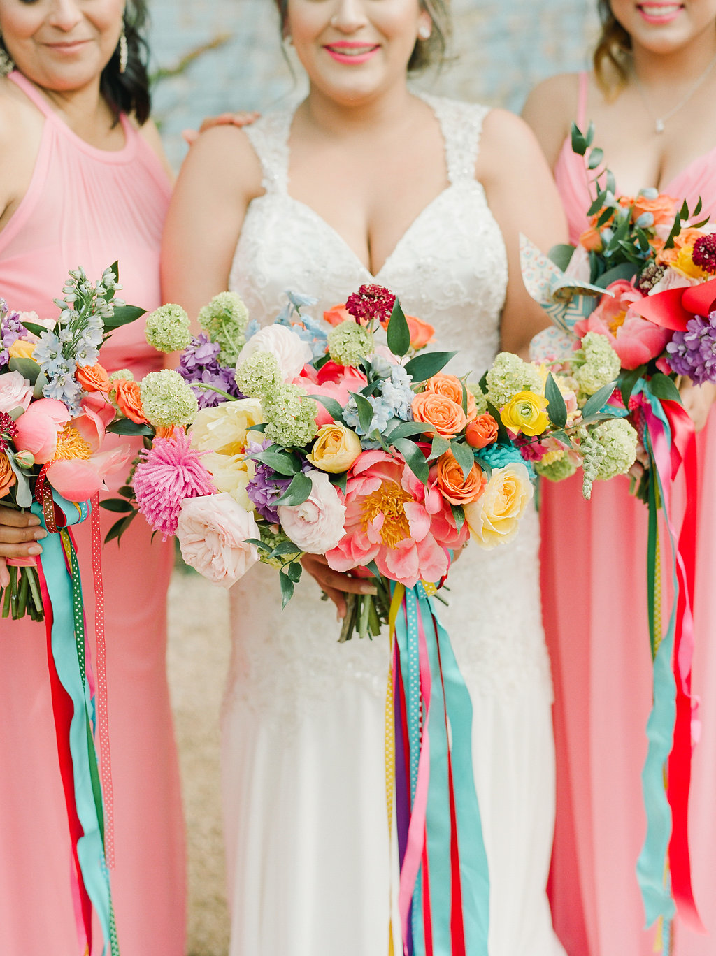 colorful wedding bouquets with bright ribbons - https://ruffledblog.com/modern-playful-texas-carnival-wedding