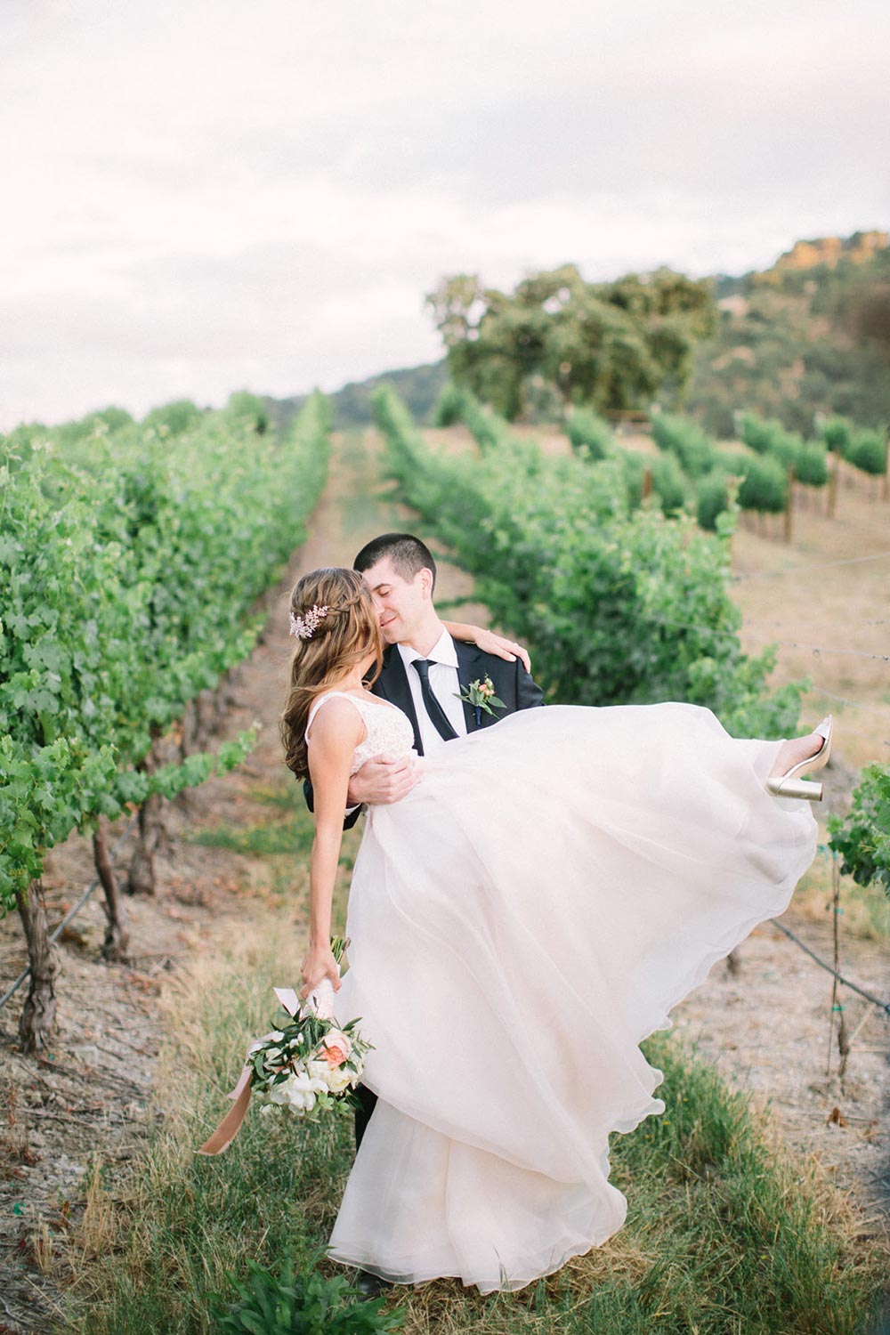 vineyard wedding bride and groom flowy wedding dress